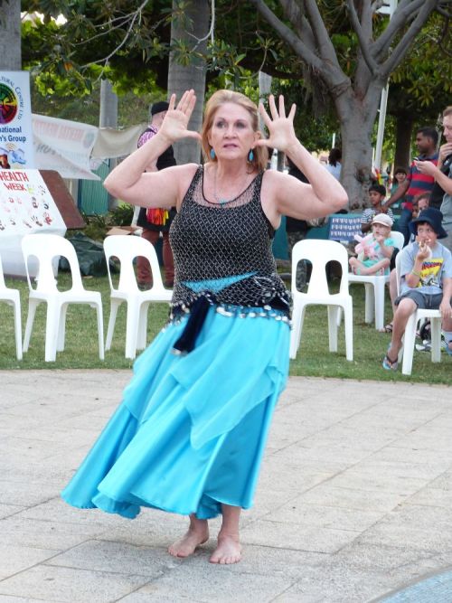 Confident women dancing during mental health awareness week in Townsville at The Strand. Photography