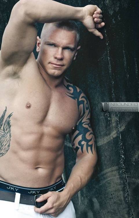 undie-fan-99: Beefy tattooed boy with his Jockey boxerbriefs waistband showing!