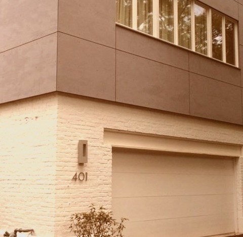 Chicago ExteriorA Medium-sized, Gray, Two-story Concrete Building With A Flat Roof.