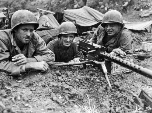 GIs from the 77th Infantry Division man a machine gun nest on the island of Shima, May 3, 1945. The 