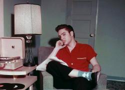 antiquejunky:  Elvis Presley listening to