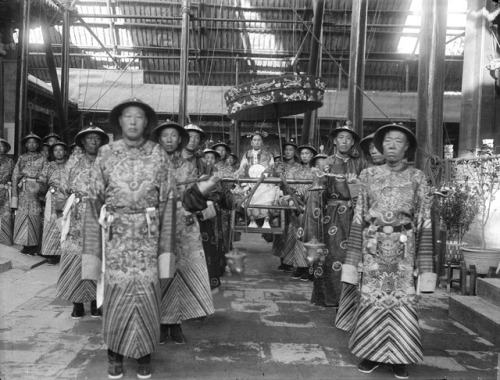 Empress Dowager Cixi of China (29 November 1835 – 15 November 1908) surrounded by eunuchs in the For