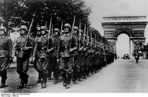 German Soldiers parading down the Champs-Élysées (June 14th, 1940).