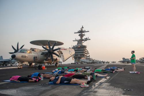  Yoga / Army girl / U.S. 5th Fleet.The flight deck of an aircraft carrier is probably the least