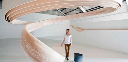 Magnus Celestii is a natural wooden desk that spirals up to the ceiling. Designed by Joseph Wal