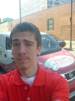 storyofagayboy:  Me and the company van… Notice the confused look on my face, that is because I ended up on the other side of the Schuylkill River somehow. 