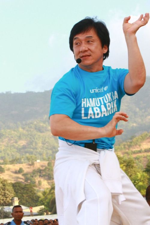 Jackie Chan leads students in a martial arts exercise in Timor Leste © UNICEF
