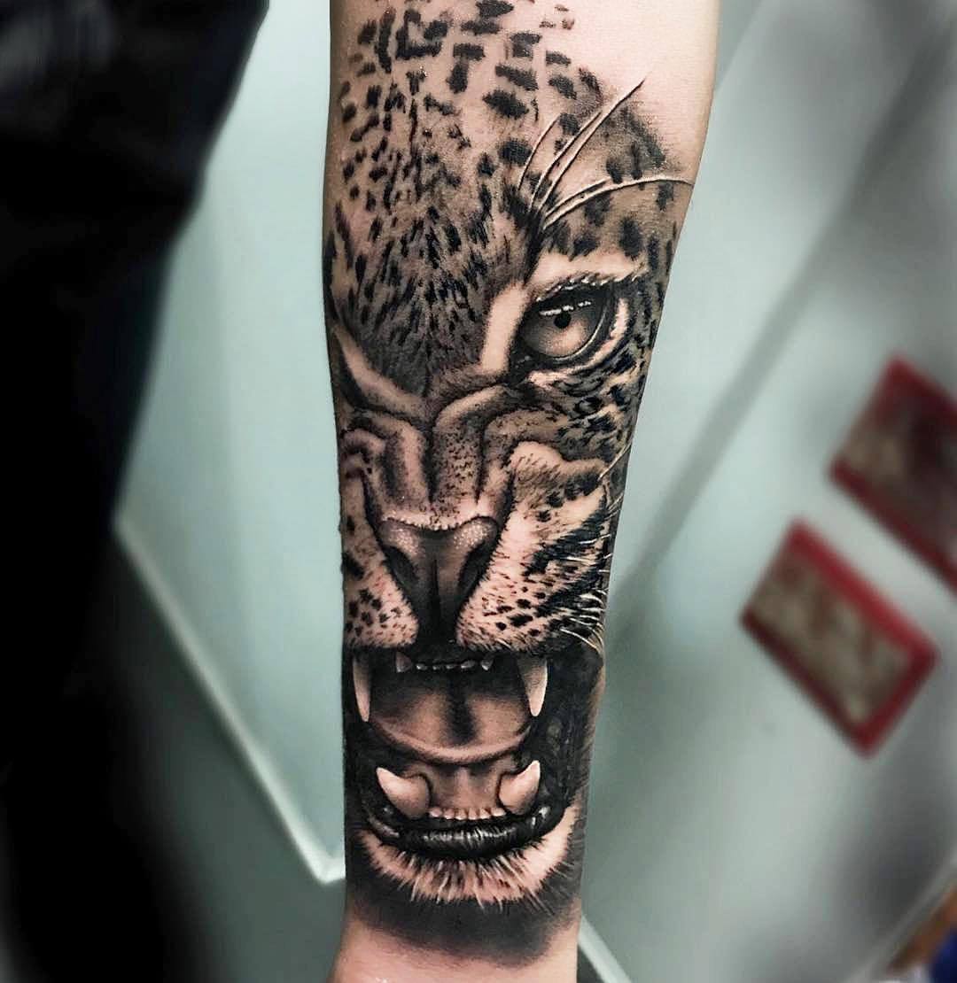 Heart filled cheetah tattooed on the forearm
