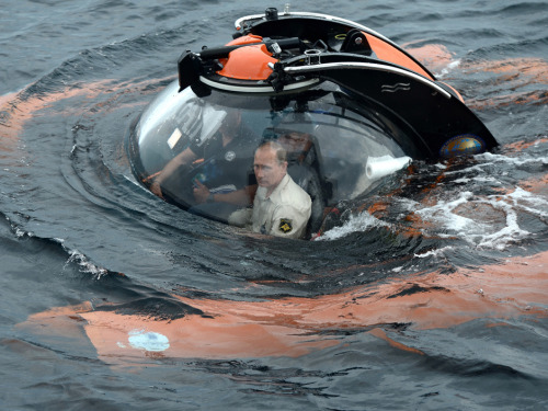 Puny sea, you are no match for Vladimir Putin: Russian president plunges below waves in submersible