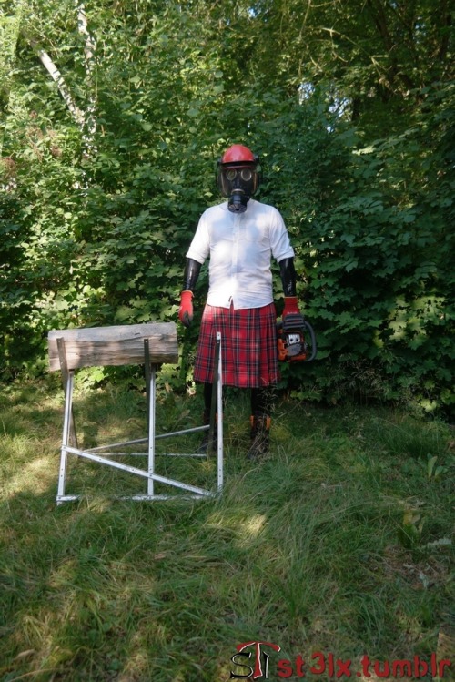 The Rubber Highland Games 2018 - Part 4 of 7Rubbered husband cutting wood in the garden