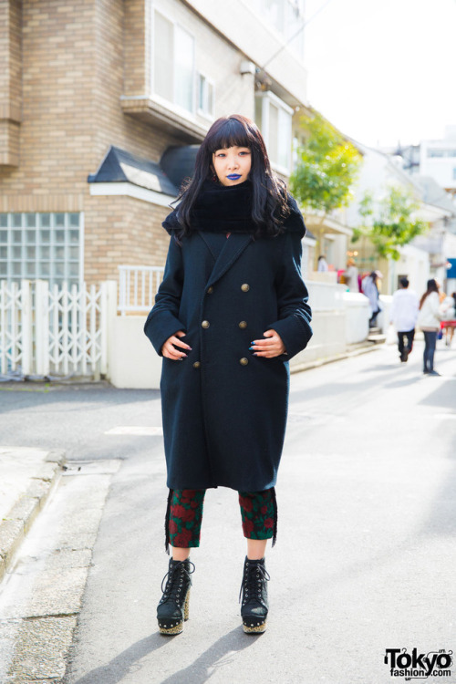 Honami on the street in Harajuku wearing a coat and floral pants from the Japanese brand h.t.maniac 