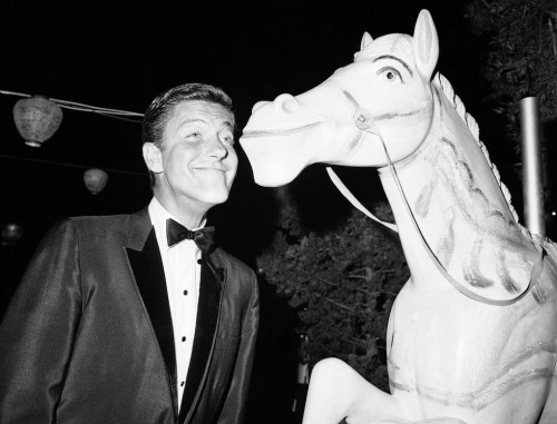 historicaltimes:Dick Van Dyke poses with a carousel horse at the Mary Poppins’ premiere on September