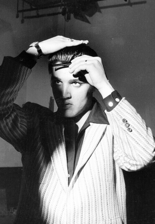 takingcare-of-business: Elvis Presley fixing his hair backstage on the Milton Berle Show, June 5, 19