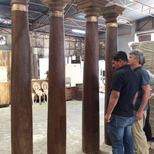 Tall “country wood” pillars from North India. Love the brass collars and the dark stain 