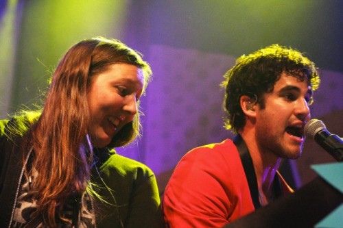 Darren Criss with a fan on stage in concert at The Fillmore in San Francisco, CA