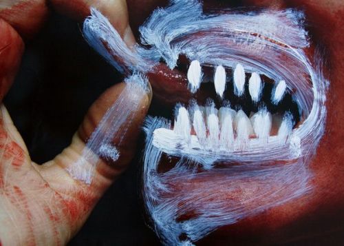 Human with Red Makeup and White Teeth, by Manuel Granados.