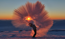 zooophagous: elegantbuffalo:  Ontario-based photographer Michael Davies timed this impressive shot of his friend Markus hurling a thermos of hot tea through the air yesterday in -40°C weather near Pangnirtung in Canada’s High Arctic.  the most elegant