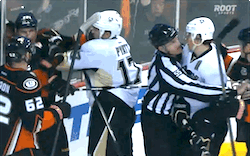 so-hockey-eh:  Ragebear Geno and the ref swooping in to skate him away.