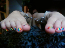 themissarcana:  Gotta love the rainbow toes…