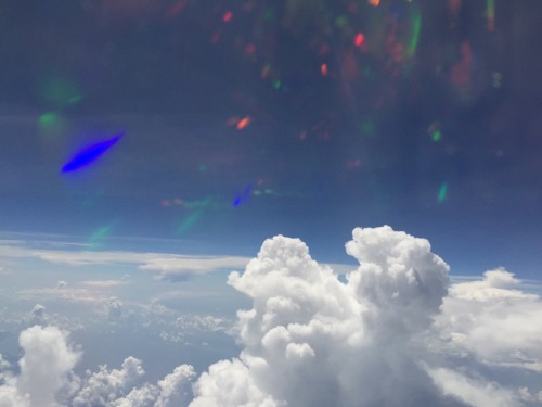 ossuarie:  explanation 1: i took plane photos with a holographic phone case. explanation 2: aliens 