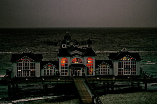 Eerily beautiful. Schaurig-Schön.Edited nightshot of the restaurant on the pier in Sellin, Baltic Se