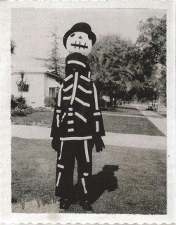 sixpenceee:  Tim Burton showing off a Halloween costume made by his mother, 1967. (Source)