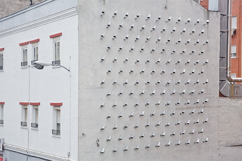 lustik:  CAMERAS, “Installation of 150 fake security cameras on building facade