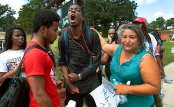 ihavenoasshole:whitecolonialism:Ferguson, MO.&ldquo;All my friends have been killed, I’m sick of it.&rdquo;- Protestor Jamell Spann yells at Ferguson police officers.It should be illegal to not reblog.