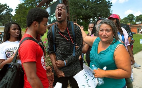 chrisctxo:ihavenoasshole:whitecolonialism:Ferguson, MO.“All my friends have been killed, I’m sick of it.”- Protestor Jamell Spann yells at Ferguson police officers.It should be illegal to not reblog.  You can almost feel his pain. I think we can