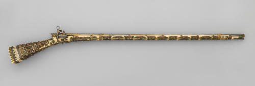 An Turkish miquelet musket decorated with gold, ivory, brass, mother of pearl, and jewels.  Late 18t