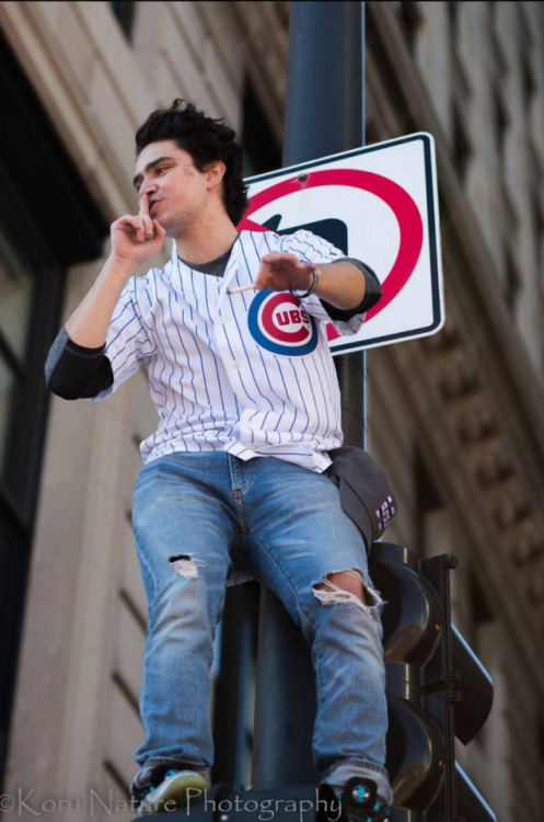 Taken at the 2016 Chicago Cubs Rally in Chicago. This guy decided he needed a better view.