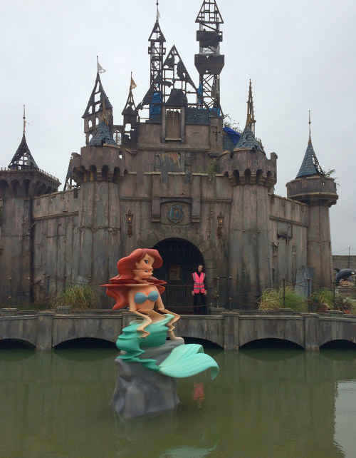 sixpenceee:  Creepy Disney-Inspired Amusement ParkWelcome to Dismaland, an art amusement park created by artist Banksy that will haunt your dreams. Dismaland is a five-week show housed inside and around a derelict  Tropicana building in Weston-super-Mare,