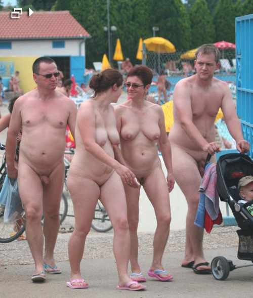 Nudist families swimming