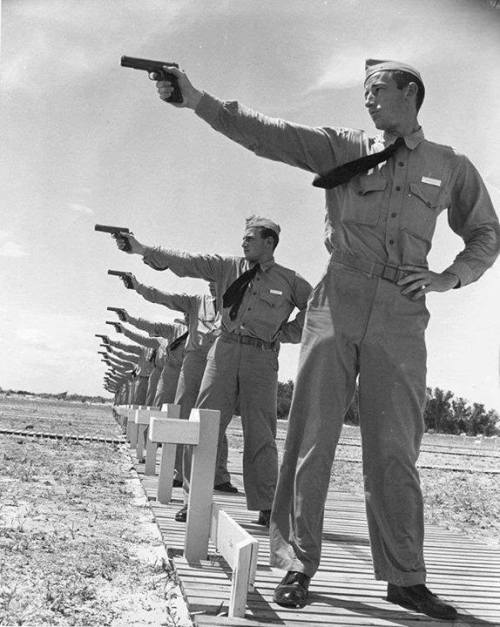 warhistoryonline:Naval Aviation Cadets from the Naval Air Station at the pistol range with Colt pist