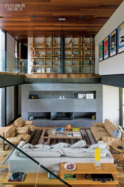 interiordesignmagazine:  Miguel Pinto Guimarães brings urban rigor to a weekend retreat for a Rio family in Brazil. Shown: Sergio Rodrigues’s pair of chairs and sofa face each other in the living area. Photography by Leonardo Finotti.