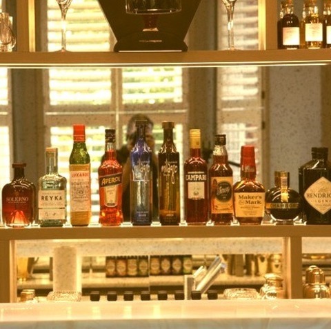 Modern Home Bar LondonLarge, Contemporary, Single-wall Bar Cart With A Drop-in Sink, Open Cabinets, Light