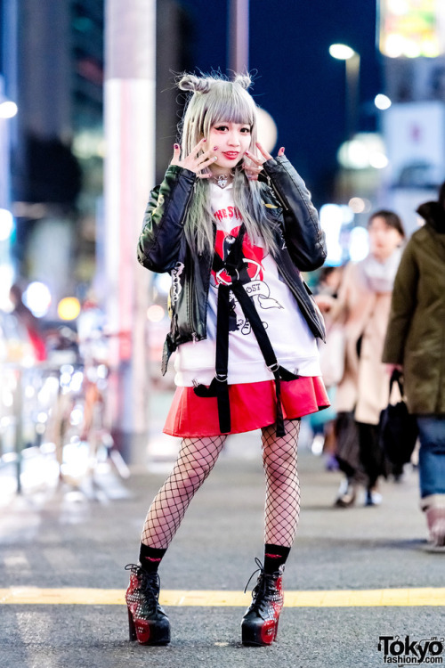 Japanese singer and model Asachill on the street in Harajuku at night wearing a Joyrich jacket over 