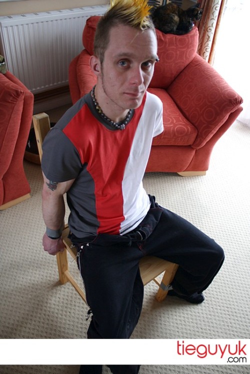 Another of my favourites from tieguyuk. I love skater/punk guys and this guy taped to a chair i