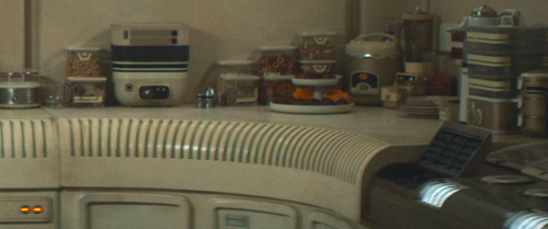 I Love The Design Of Eedy's Kitchen With Its Tiny Cramped Dining Area, Dim Lighting, Yellowed Walls,