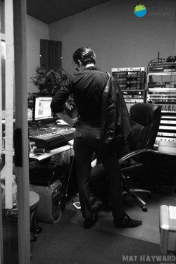 arcticmonkeys-news:Alex listening to the audio after the room had cleared,Arctic Monkeys EndSession at Seattle Drum School