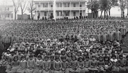 lilrednacho:  starshineexx:  photosbyjaye:  This is probably one of the most depressingly heart-wrenching photos I’ve ever seen. Native American children taken from their families and put into school to assimilate them into white society. the slogan