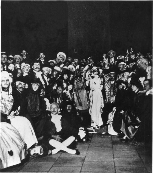 Marchesa Luisa Casati (centre in white) and Leopard at one of her legendary masquerades at Piazza Sa