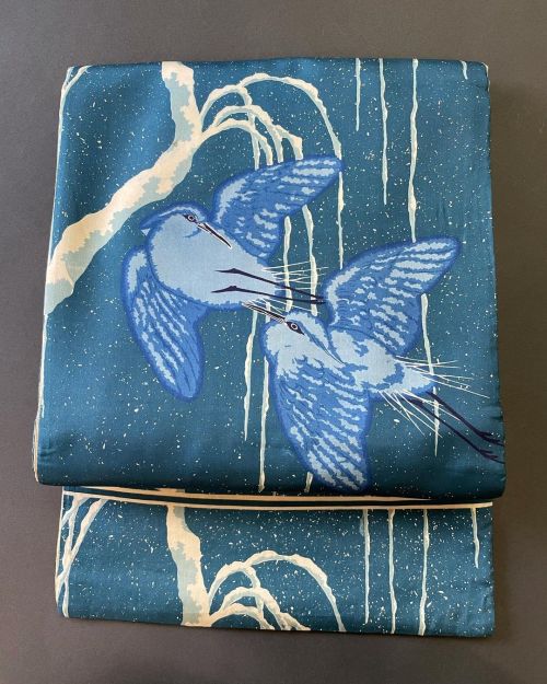 Sagi (herons) flying by a frozen willow under a snowy sky (antique obi seen on).The blueish tones ch