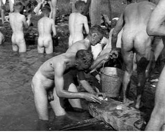 vintagemusclemen:Is the guy in the foreground scrubbing something on that rock?