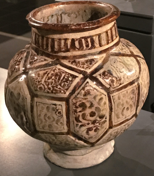 Lustreware jar from the Persian city of Kashan with Mesopotamian Kufic script inside the rim. The ja