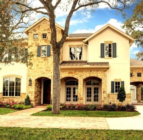Houston Stone ExteriorInspiration For A Transitional Beige Two-story Stone Exterior Home Remodel