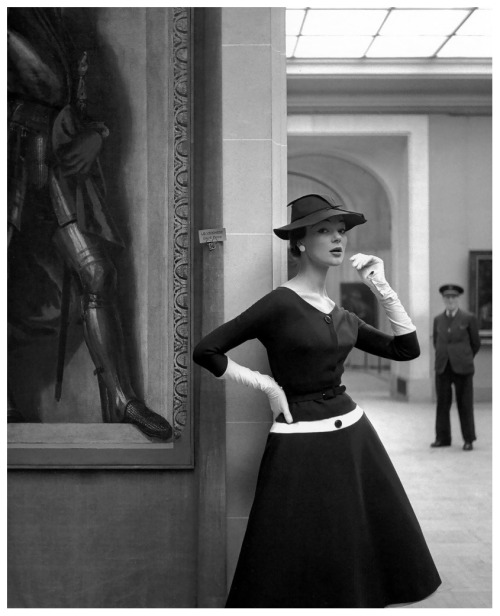 Ivy Nicholson with art in museum in a wool jersey dress by Jacques Fath. Photograph by Georges Dambi