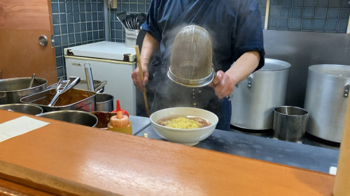  The final touches on a classic shoyu ramen bowl at 麺ロード in Tokyoalojapan.com