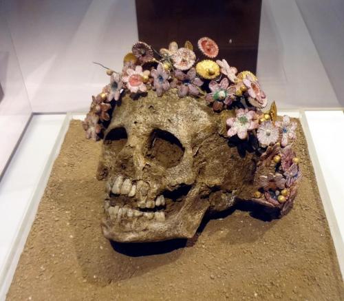 konkottas:    This is the skull of a girl, found wearing a ceramic flower wreath, from 300-400 BC Greece.   