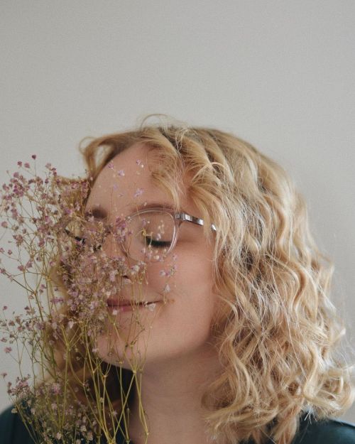 I wish I could always have curly hair and be surrounded by flowerscould also be captioned: I got the